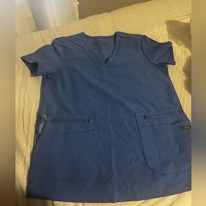 FIGS. Worn once. XS women’s ceil blue top. Limited edition pockets.